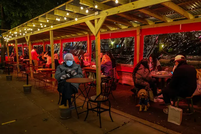 Bernie Sanders photoshopped into an outdoor dining scene